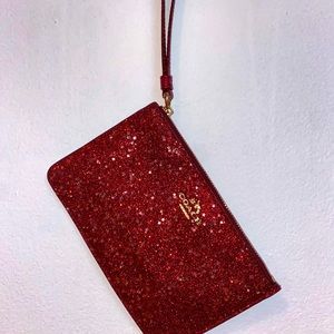 ruby red glitter coach wristlet